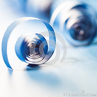 Macro, abstract, background picture of blue paper spirals on paper background