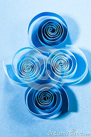 Macro, abstract, background picture of blue paper spirals on paper background