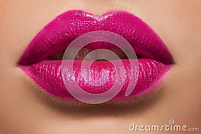 Macro photo of women s lips with pink lipstick