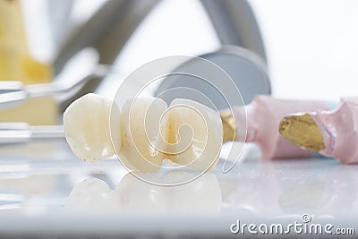 Macro of prosthetic teeth with dental tools