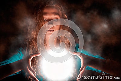 Magic woman with light sphere