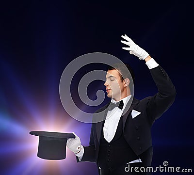 Magician in top hat showing trick