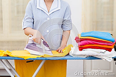 Maid ironing clothes