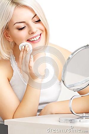 Makeup Applying. Beautiful Woman does Daily Makeup. Cosmetic Sponge