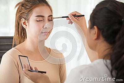 Makeup artist applying eyeshadow