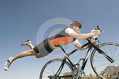 Male Cyclist Balancing His stomach On Bicycle Seat