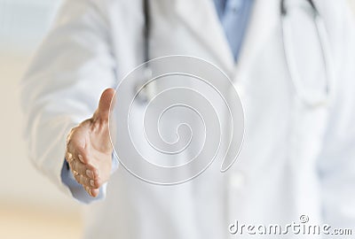 Male Doctor Extending His Hand For A Handshake