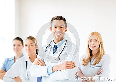 Male doctor in front of medical group