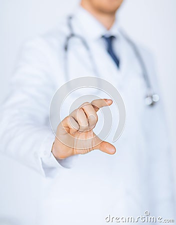 Male doctor holding something in his hand