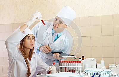 Male doctor and nurse in medical laboratory