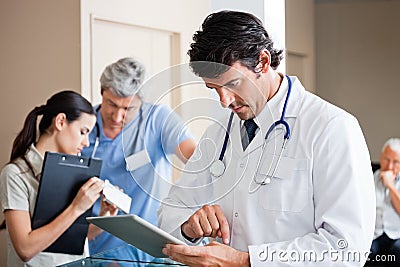 Male Doctor Using Digital Tablet