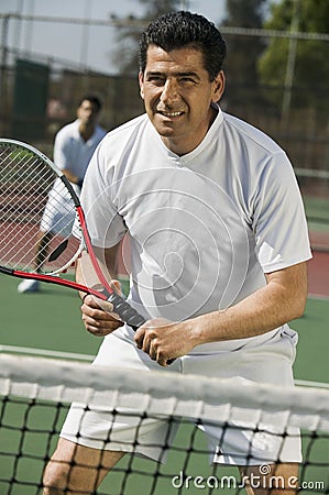 Male doubles tennis players waiting for serve