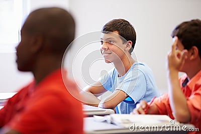 Male High School Pupil In Class