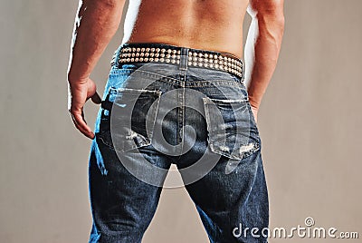 Male muscle in jeans rear view