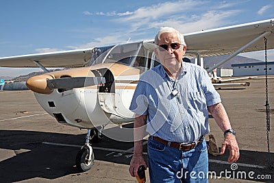 Male senior and private airplane