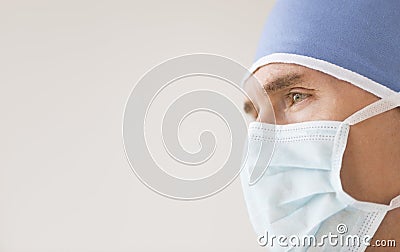 Male Surgeon Wearing Surgical Mask And Cap