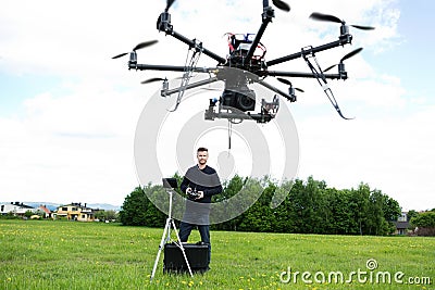 Male Technician Flying UAV Octocopter