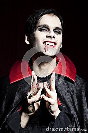 Male vampire smiling dangerously