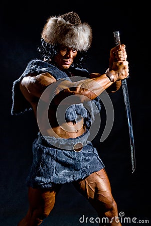 Male warrior with a sword in the form of a barbarian