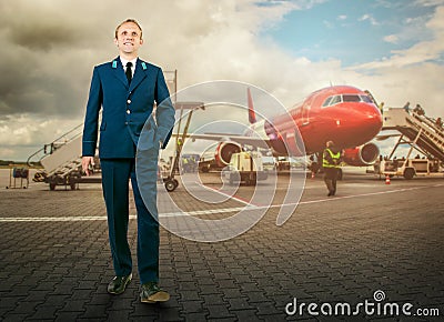 Man in aircraft uniform on airport area