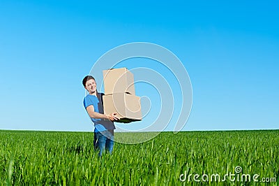 Man in blue t-shirt carrying boxes