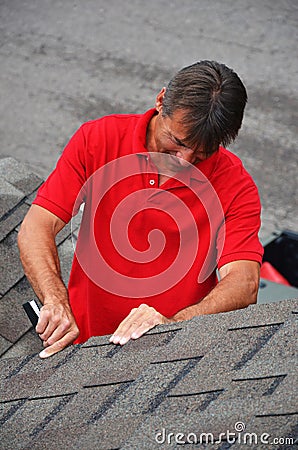 A man with a book on a roof