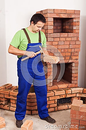 Man building masonry heater