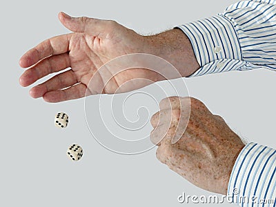 Man in business shirt rolling two dice - sixes