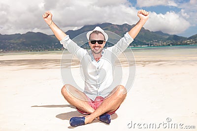 Man celebrating success on the beach