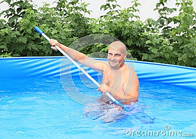 Man cleaning pool