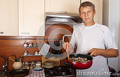 Man cooks meat