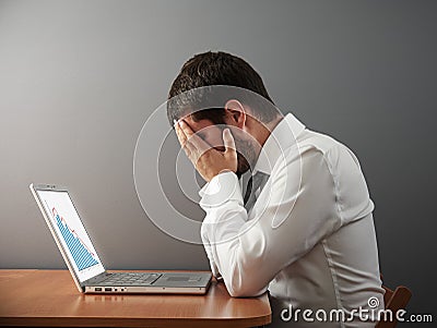 Man covering his face by the hands