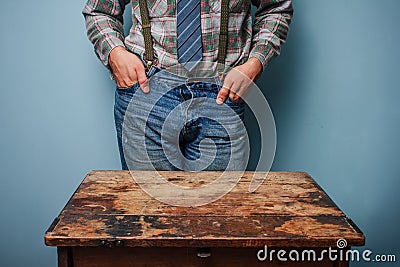 Man at desk with hands in pockets