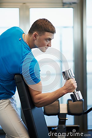 Man doing exercises dumbbells