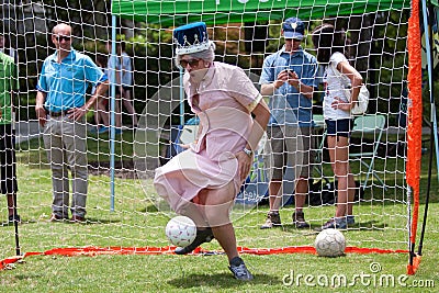 Man Dressed As Queen Elizabeth Plays Soccer Goalie At Festival