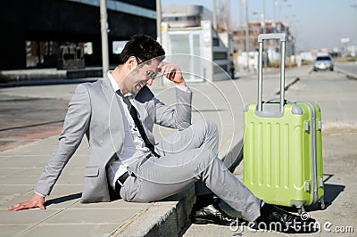 Man dressed in suit with a suitcase