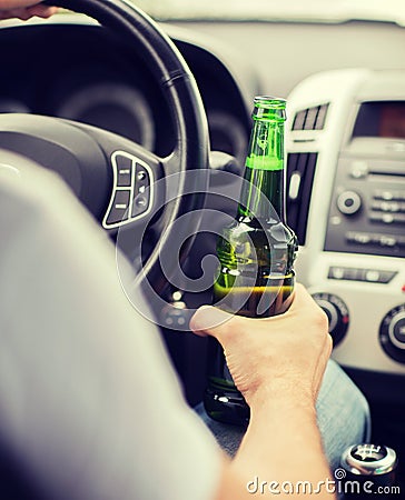 Man drinking alcohol while driving the car