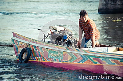 Man driving a longtail boat