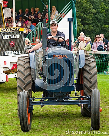 Man driving old Tractor