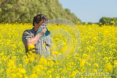 Man in the field suffers from allergies