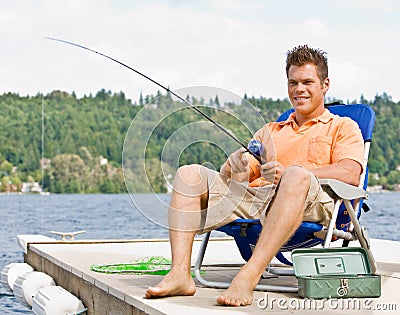 Man fishing on pier