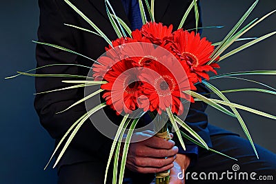 Man with flowers of gerberas