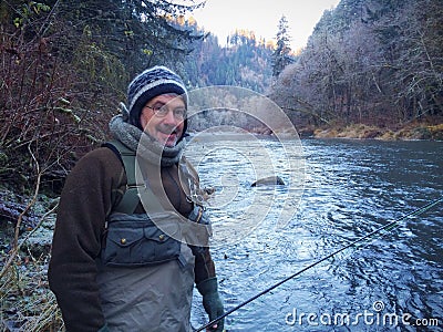 Man Fly Fishing in Cold Winter Weather