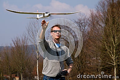 A man flying a model plane