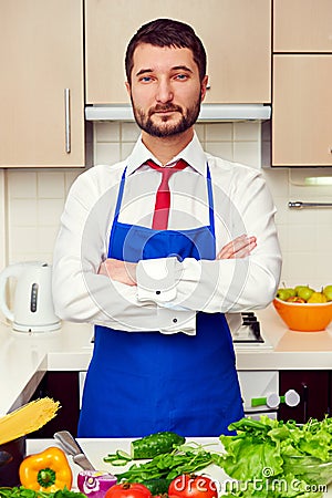 Man in formal wear and blue apron