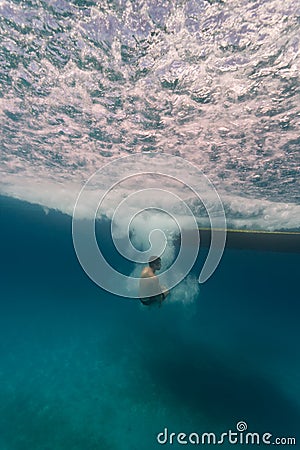 Man free diving from boat on coral reefs in Hol Ch