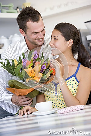 Man giving woman bouquet of flowers