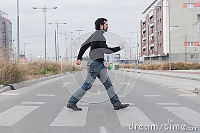 Man going through a zebra crossing