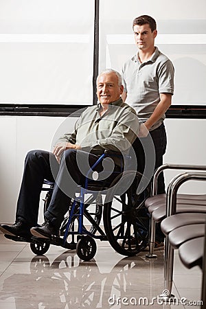 Man With Grandfather Sitting In Wheelchair