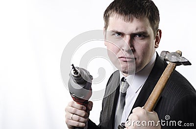 A man with a hammer and drill